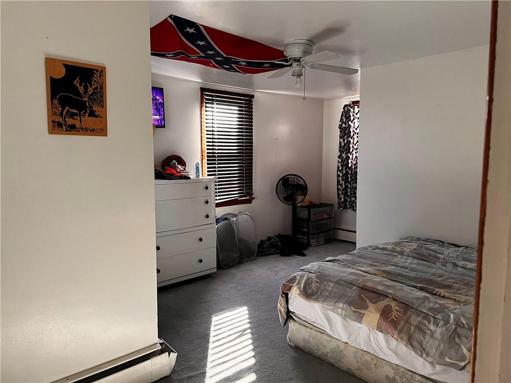 110 Walters Street Derry, PA 15627 - Photo 14 of 16 a bedroom with a bed and a window