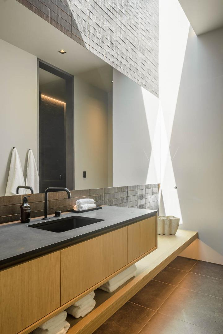 455 Pinehill Road Hillsborough, CA 94010 - Photo 22 of 33 a bathroom with a granite countertop sink and a mirror