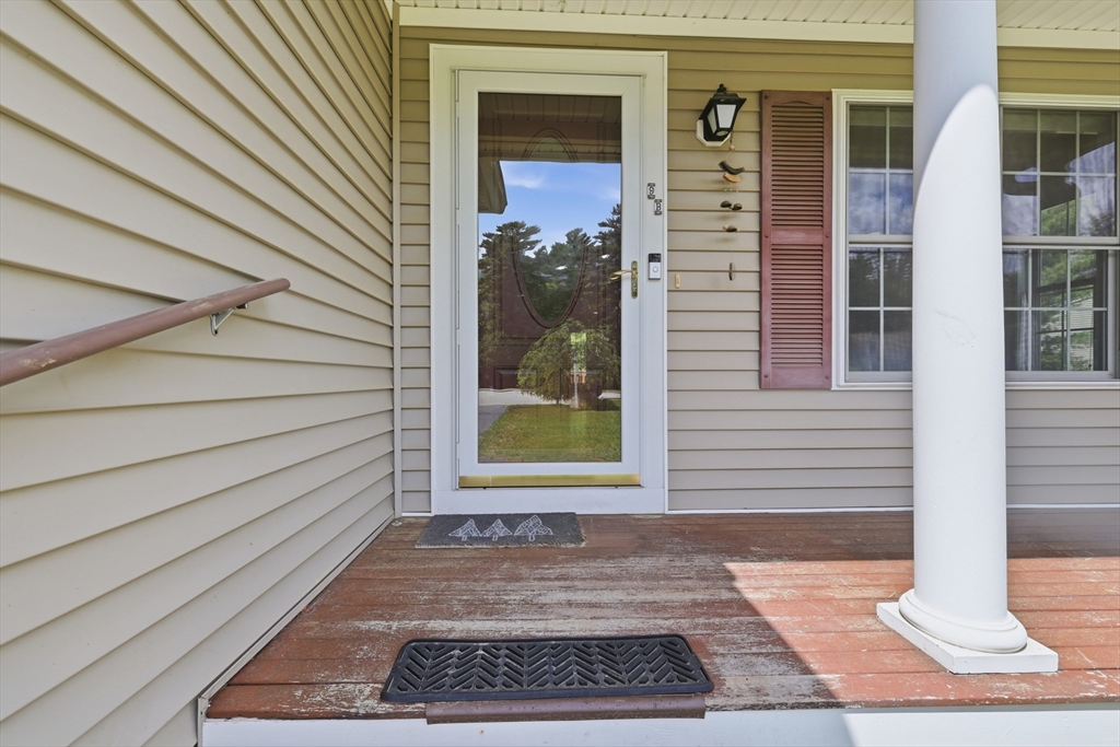 9 Rock Marsh Road, Unit B Wareham, MA 02571 - Photo 4 of 41 a front view of a house with a yard