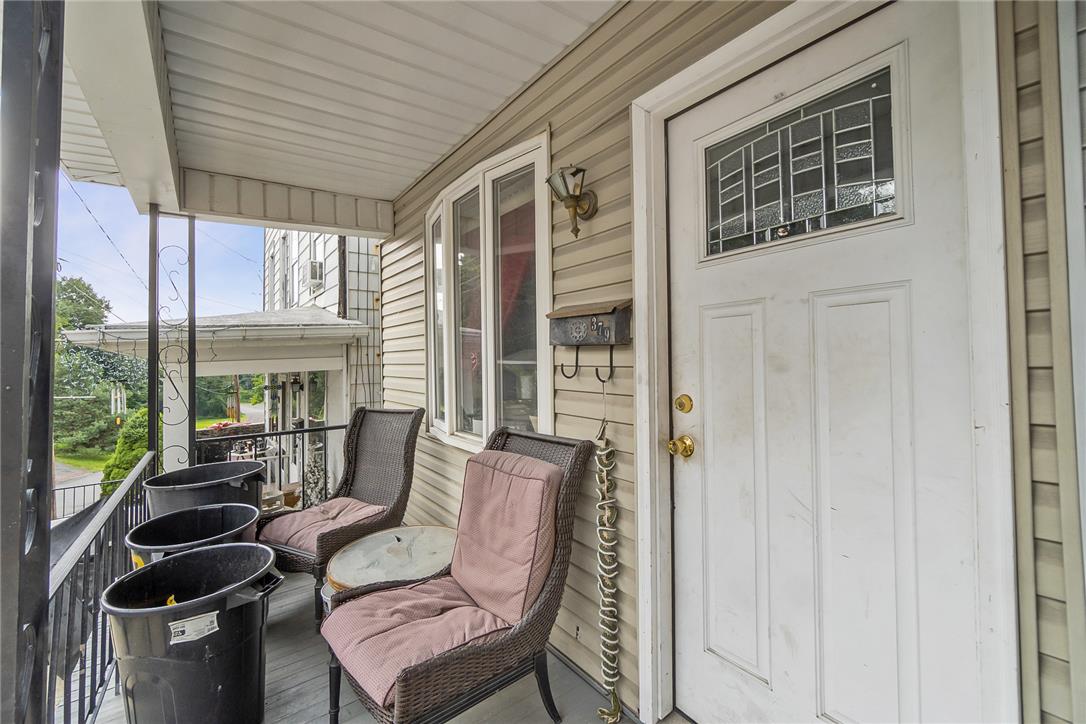 377 West Ridge Street Lansford, PA 18232 - Photo 25 of 39 A welcoming front porch features a charming entry door with decorative glass, ready to greet guests.