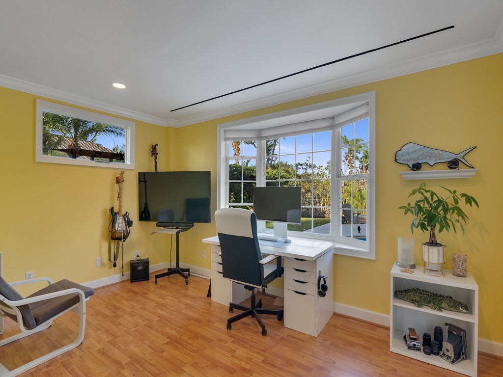 1 Cache Cay Drive Vero Beach, FL 32963 - Photo 25 of 36 a view of a workspace with furniture and a potted plant