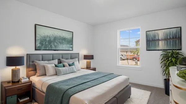 a bedroom with bed and a night stand