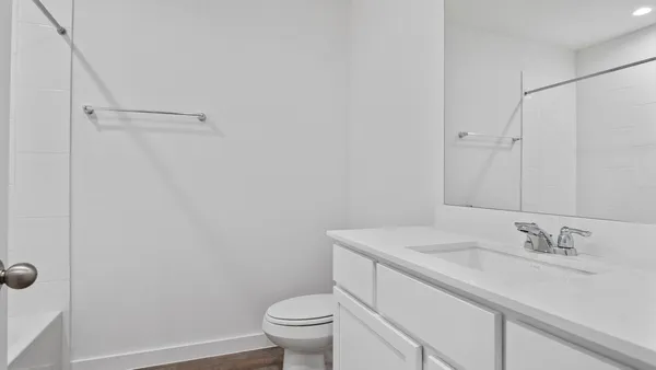 a bathroom with a sink toilet and vanity
