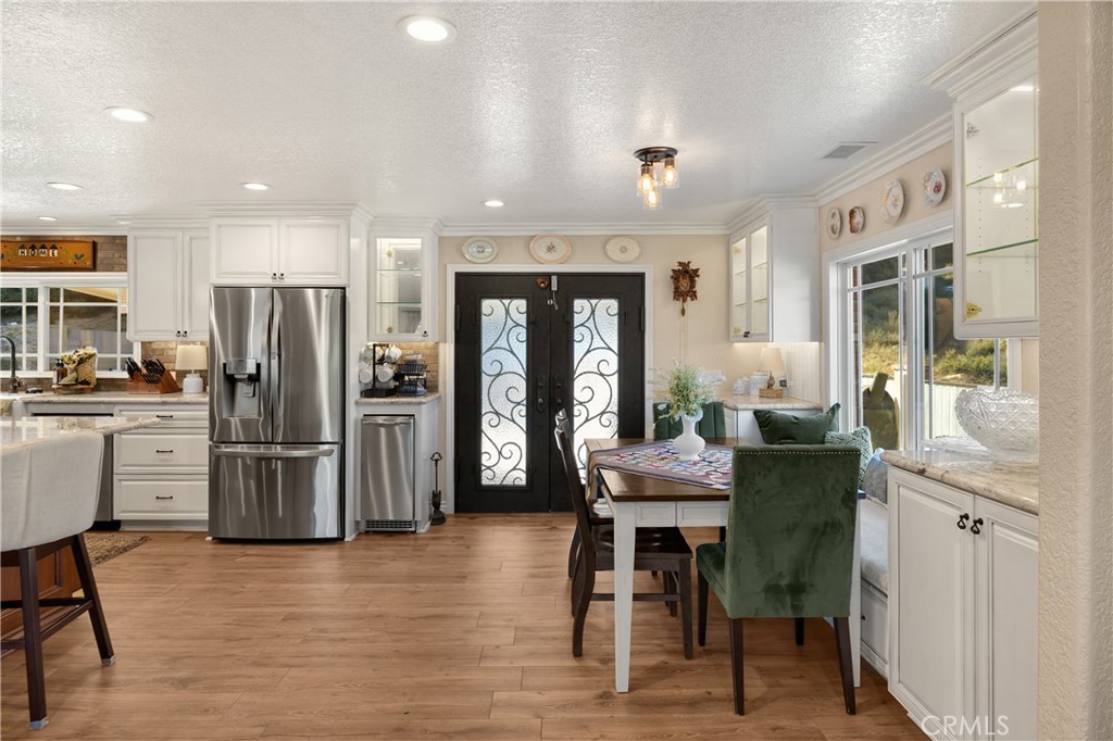 3070 Lytle Creek Road Lytle Creek, CA 92358 - Photo 14 of 68 a kitchen with a refrigerator and a table