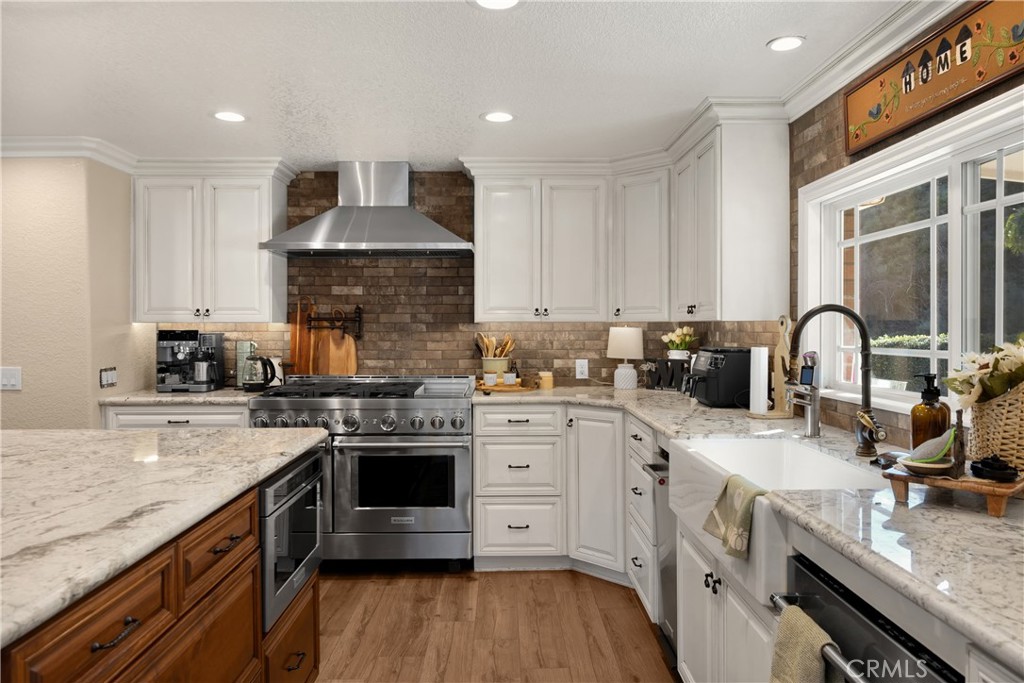 3070 Lytle Creek Road Lytle Creek, CA 92358 - Photo 16 of 68 a kitchen with a stove sink and cabinets