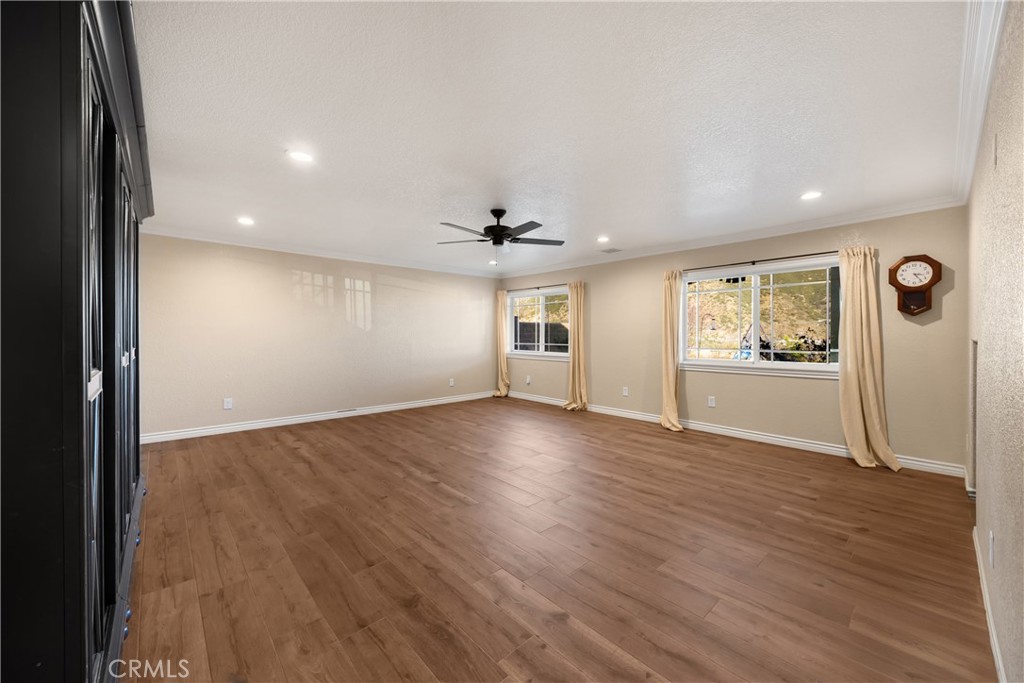 3070 Lytle Creek Road Lytle Creek, CA 92358 - Photo 29 of 68 an empty room with wooden floor and windows