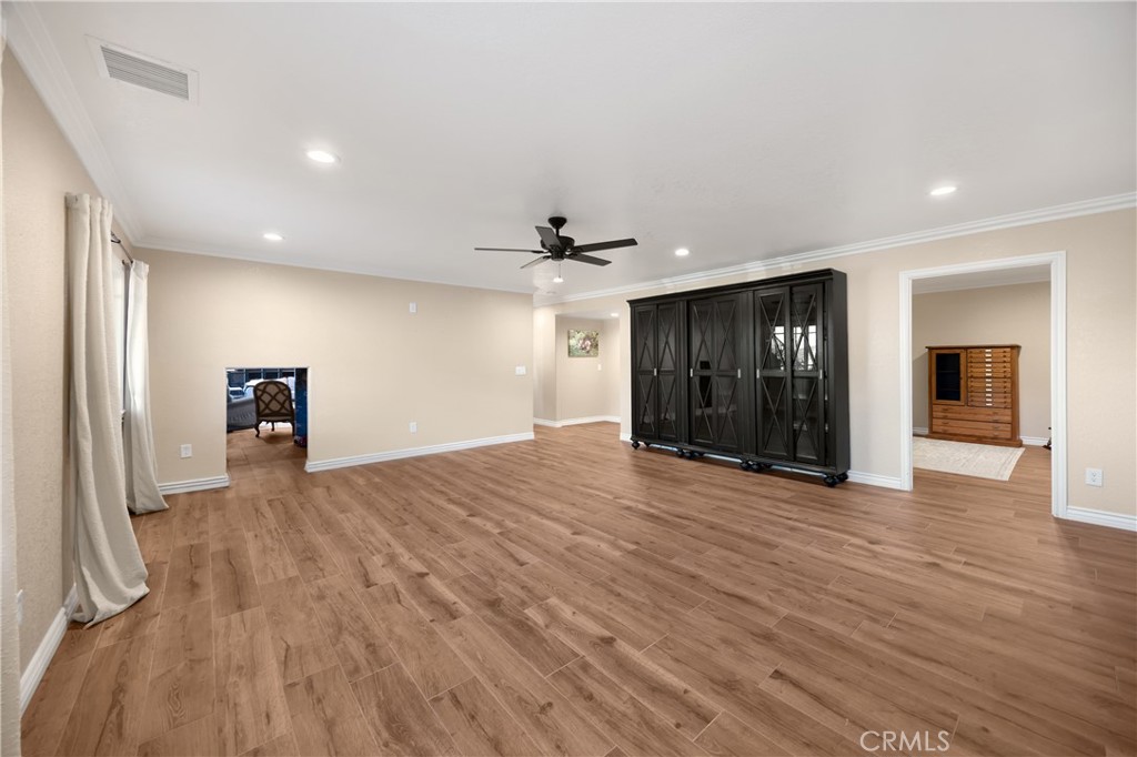3070 Lytle Creek Road Lytle Creek, CA 92358 - Photo 30 of 68 a view of a livingroom with a furniture wooden floor and a ceiling fan