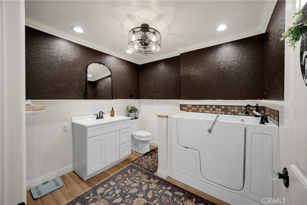 3070 Lytle Creek Road Lytle Creek, CA 92358 - Photo 32 of 68 a bathroom with a sink a toilet and a mirror