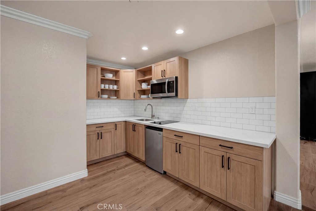 3070 Lytle Creek Road Lytle Creek, CA 92358 - Photo 41 of 68 a kitchen with sink cabinets and microwave