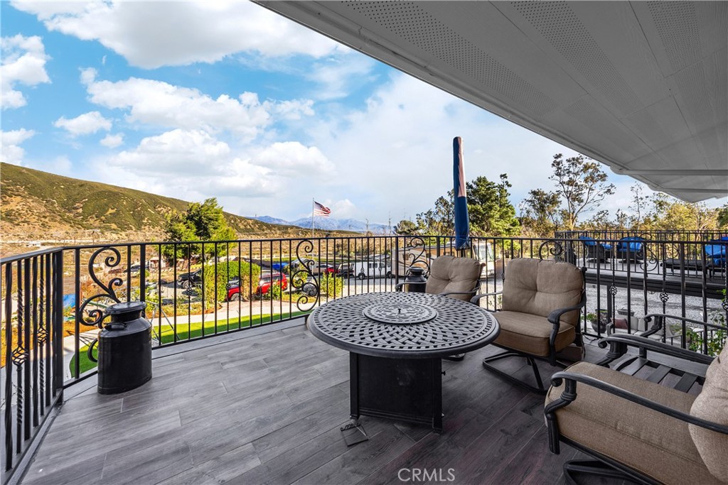 3070 Lytle Creek Road Lytle Creek, CA 92358 - Photo 55 of 68 a view of a balcony with chair and wooden floor