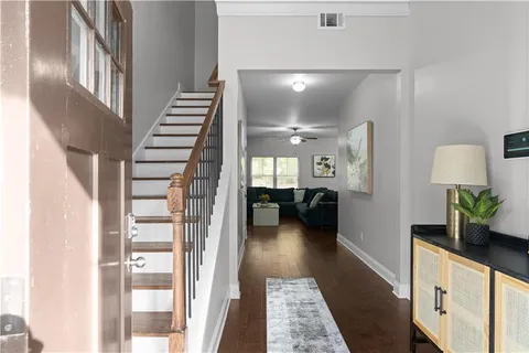 a lobby with furniture and wooden floor