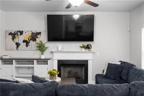 a living room with furniture and a fireplace