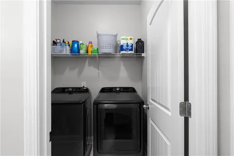 a kitchen with a stove and a refrigerator