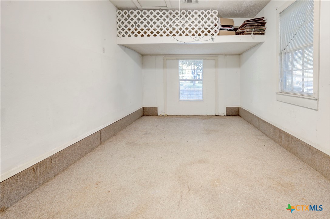 1415 North 7th Street Temple, TX 76501 - Photo 12 of 14 an empty room with a window