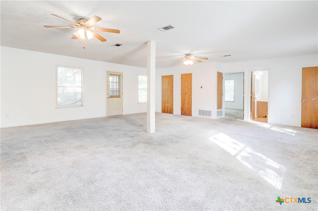 1415 North 7th Street Temple, TX 76501 - Photo 7 of 14 a view of a livingroom with a ceiling fan and window