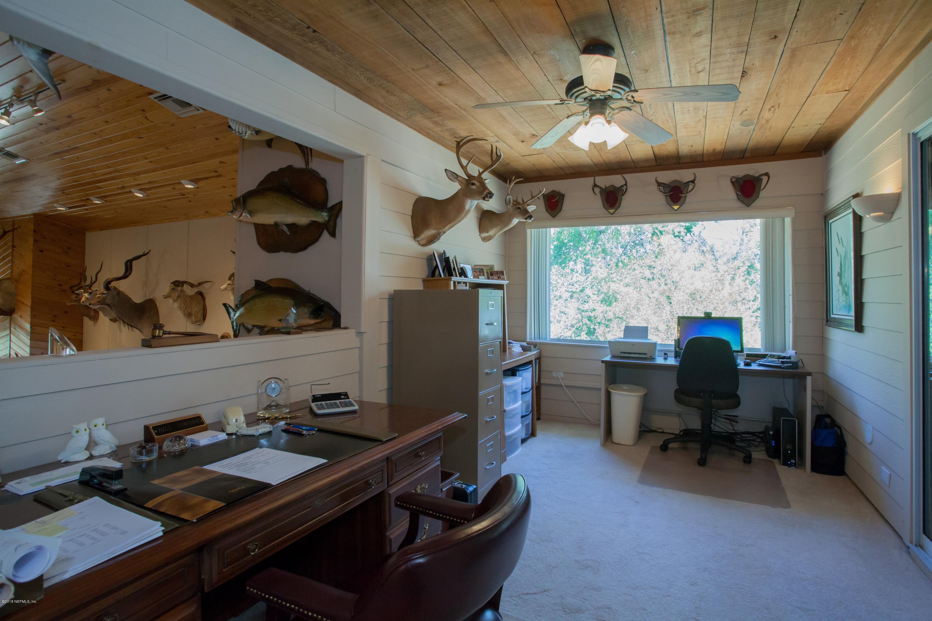 7986 National Forest Road Palatka, FL 32177 - Photo 17 of 31 a view of a workspace with furniture and a window