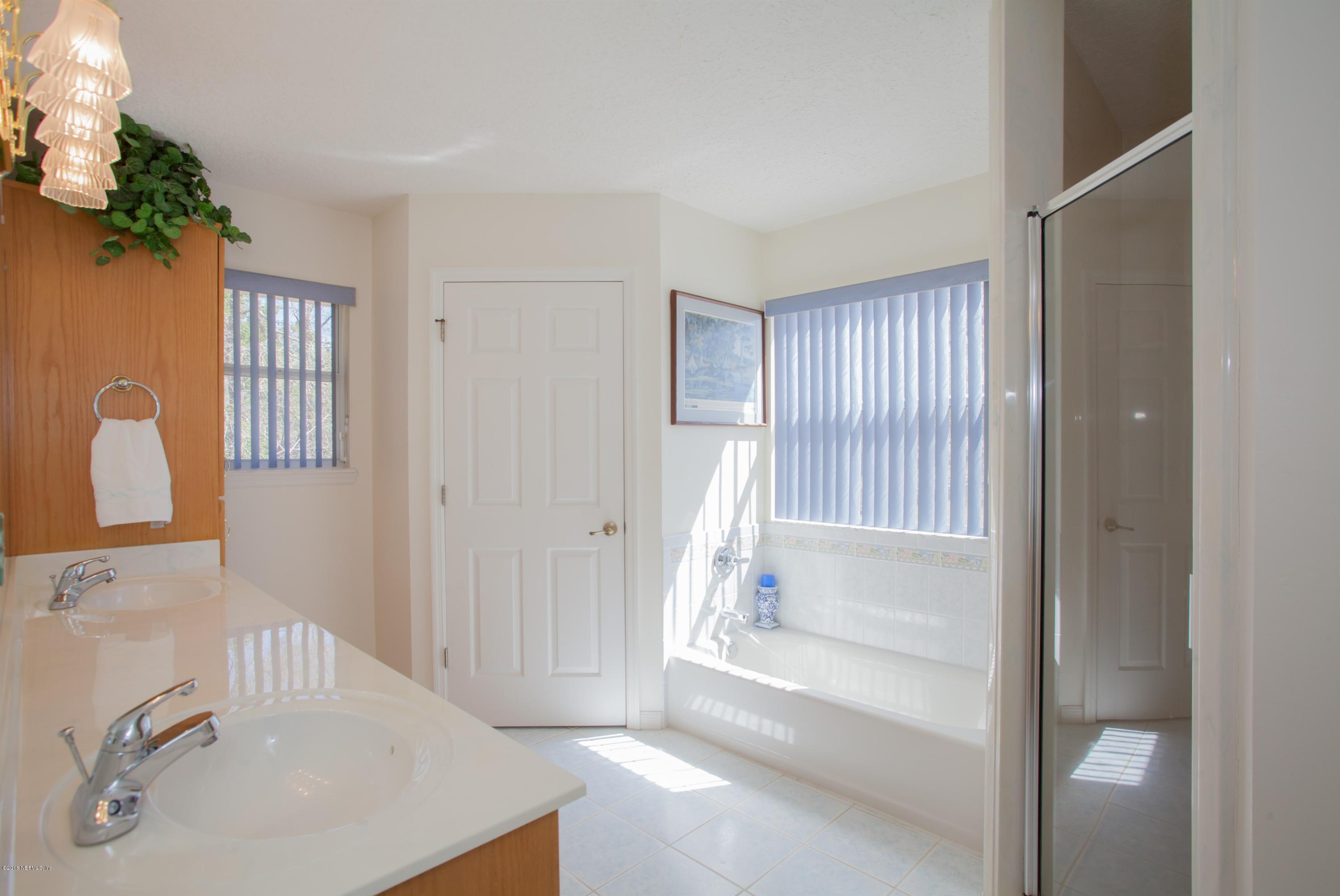 7986 National Forest Road Palatka, FL 32177 - Photo 19 of 31 a bathroom with a tub sink and a mirror