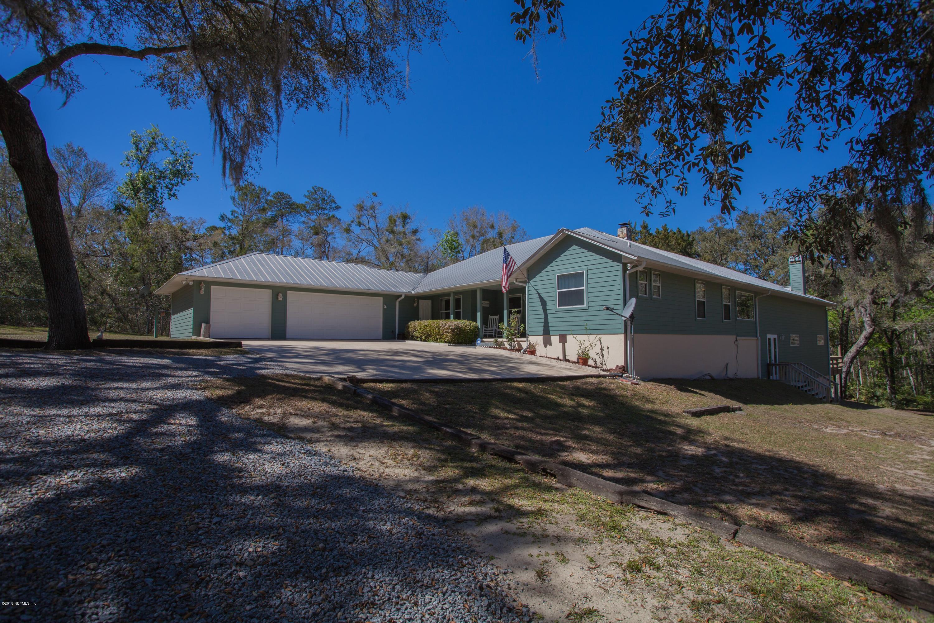7986 National Forest Road Palatka, FL 32177 - Photo 2 of 31 a front view of a house with a yard