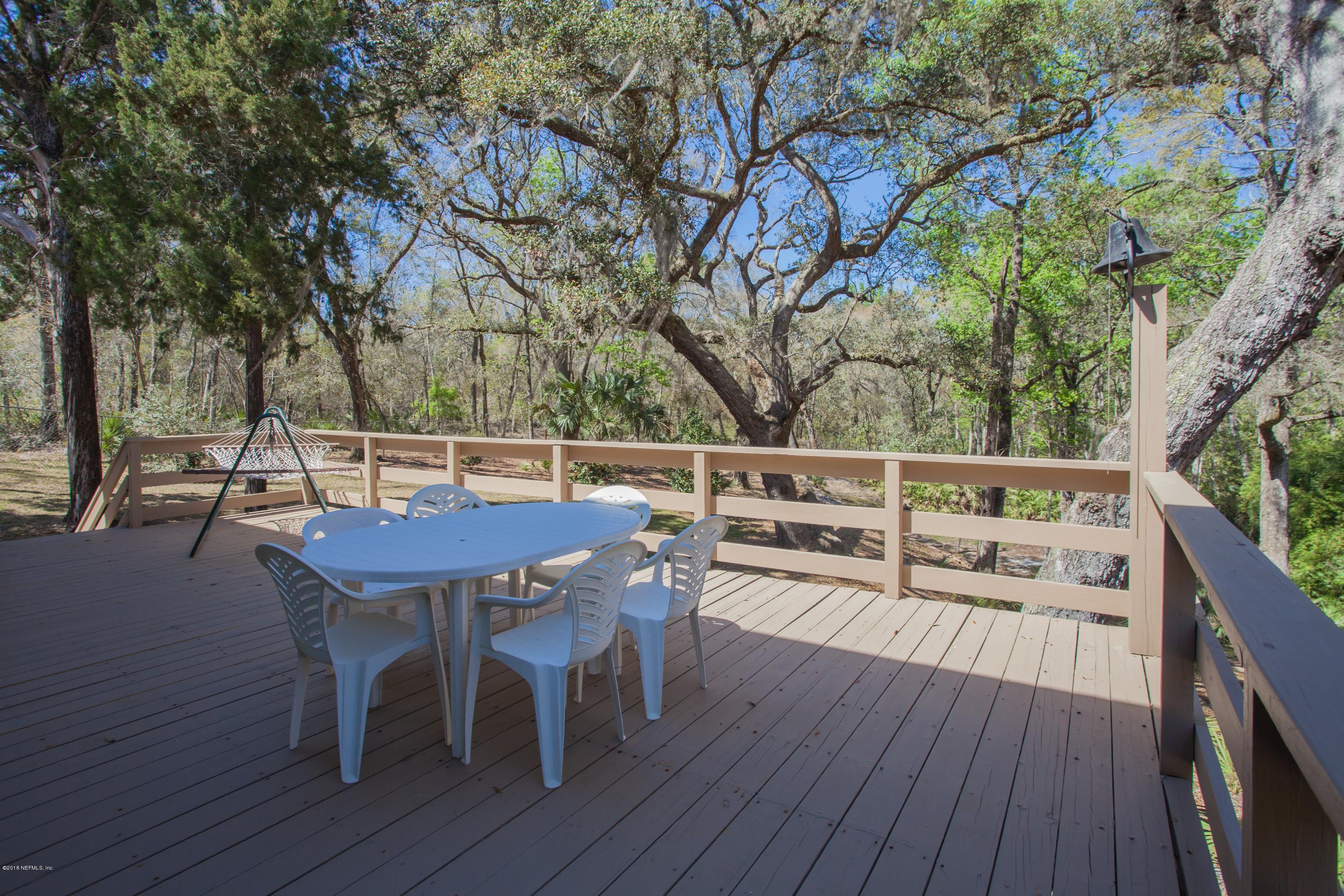 7986 National Forest Road Palatka, FL 32177 - Photo 25 of 31 a view of balcony with wooden floor and outdoor seating