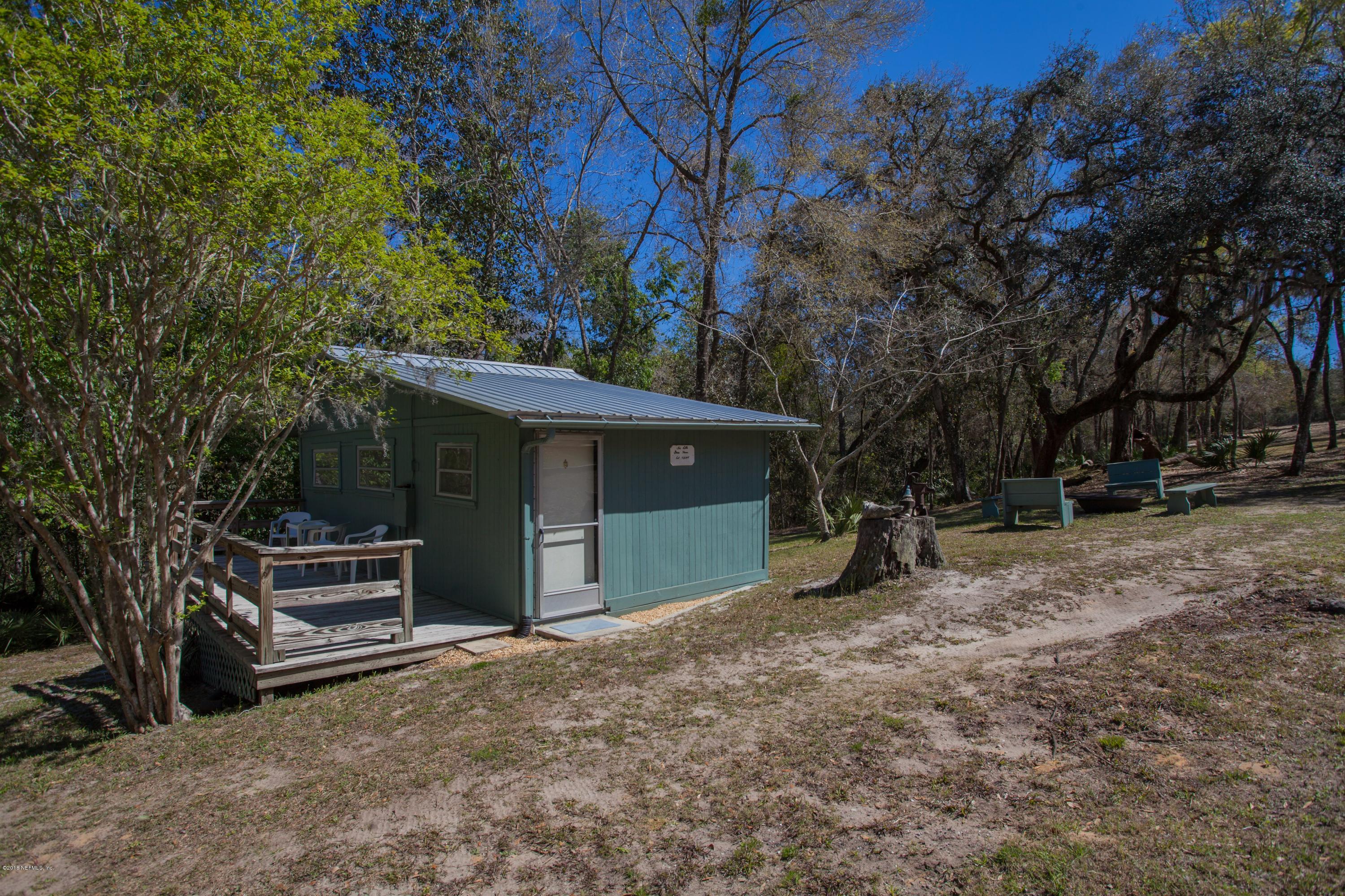 7986 National Forest Road Palatka, FL 32177 - Photo 26 of 31 a view of a house with a yard and tree