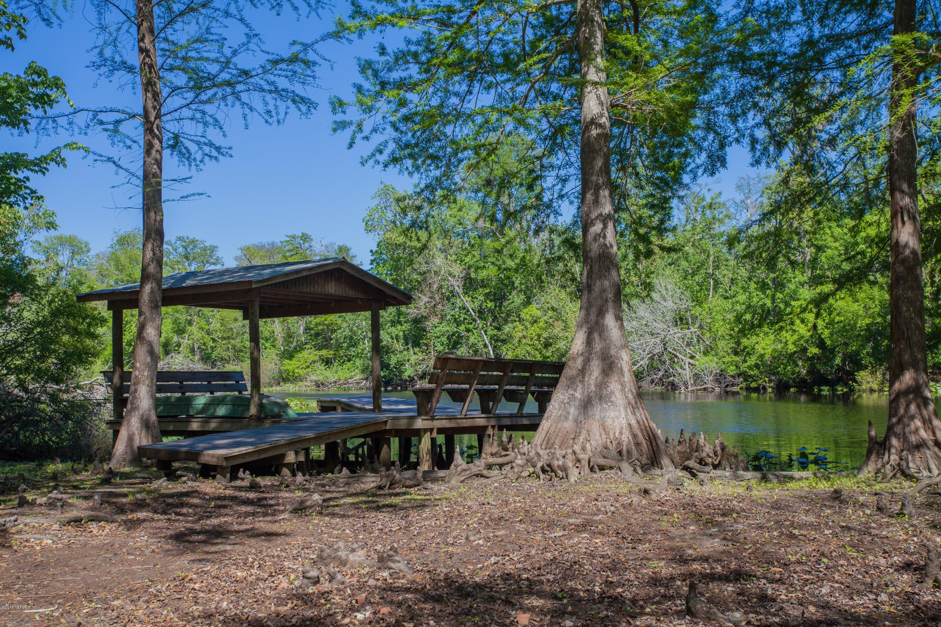 7986 National Forest Road Palatka, FL 32177 - Photo 29 of 31 a view of a wooden deck with a lake view