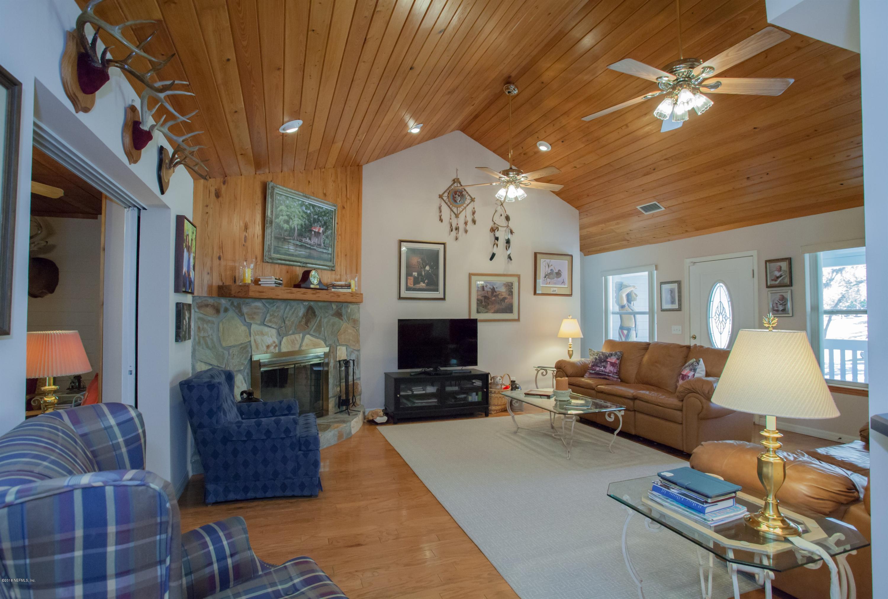 7986 National Forest Road Palatka, FL 32177 - Photo 7 of 31 a living room with furniture and a flat screen tv