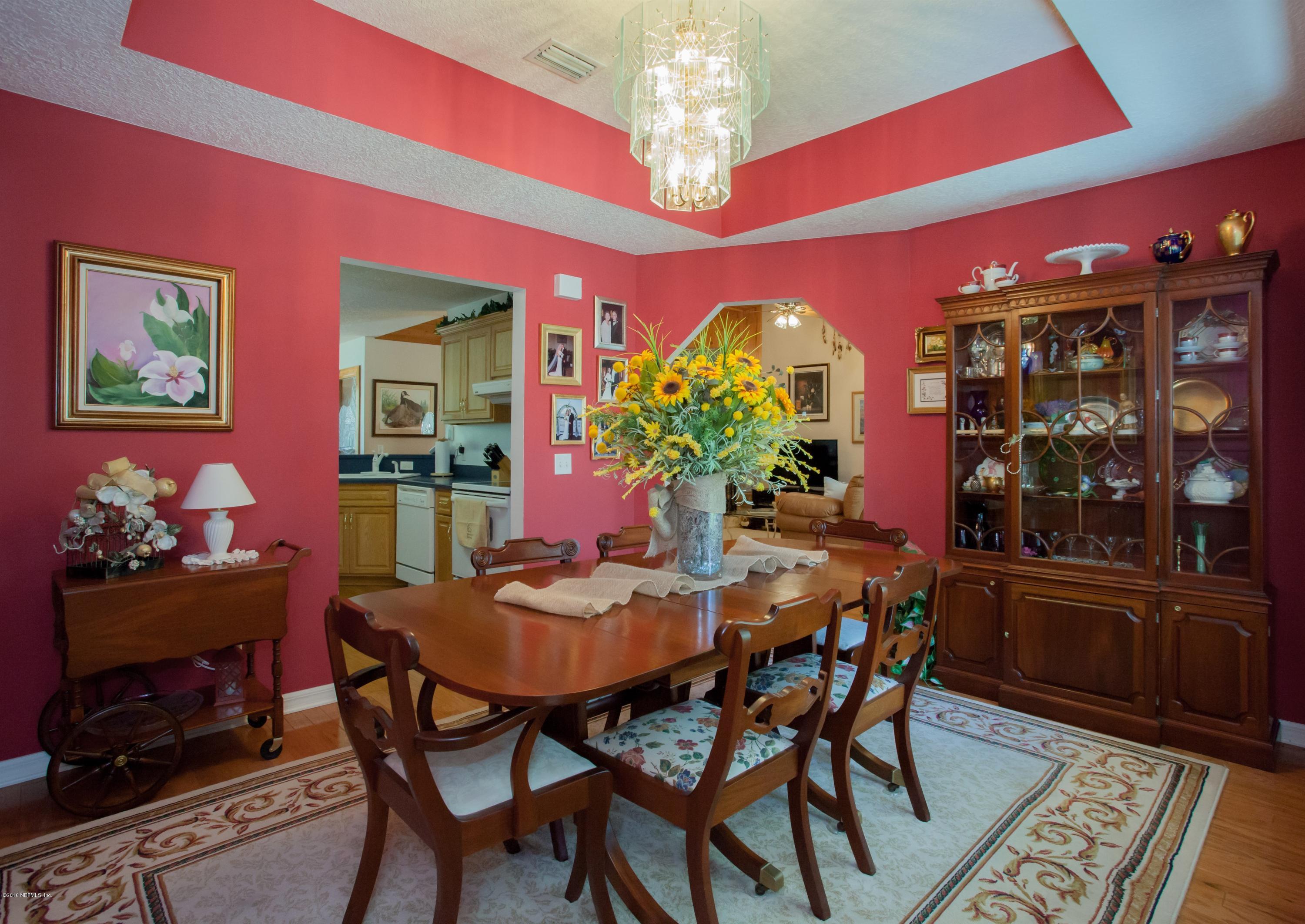 7986 National Forest Road Palatka, FL 32177 - Photo 9 of 31 a view of a dining room with furniture and chandelier