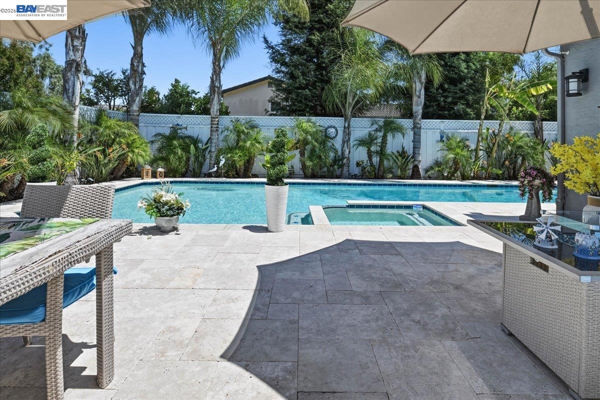 2861 Millbridge Place San Ramon, CA 94583 - Photo 41 of 58 a view of swimming pool with seating area and trees in the background