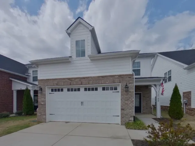 front view of a house with a garage