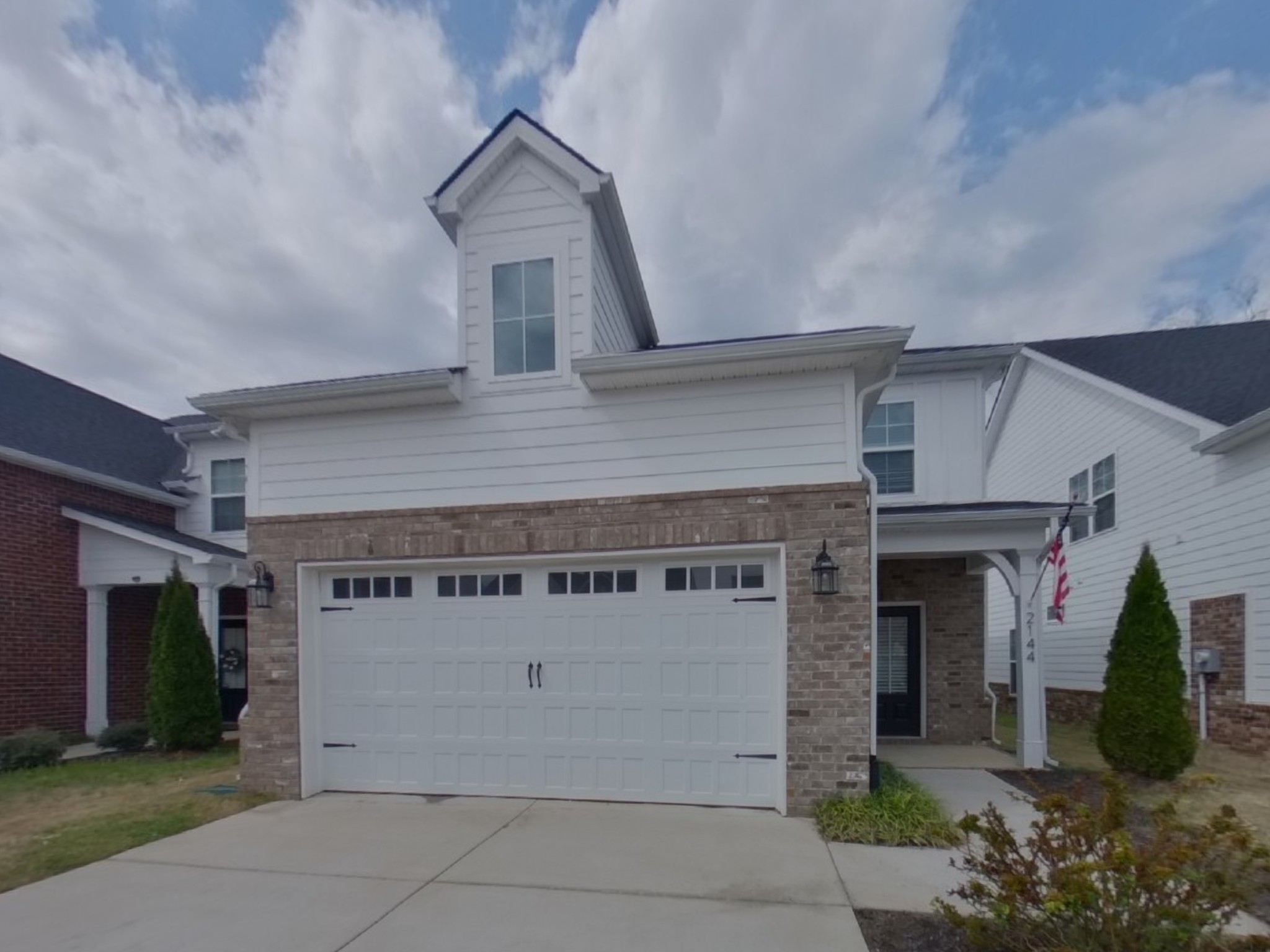 front view of a house with a garage