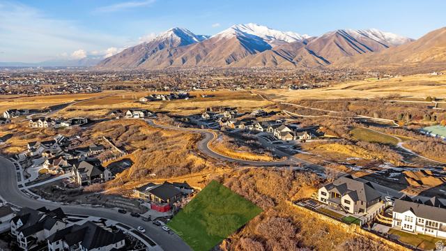 3351 South Mapleton Ests Drive, Unit 19 Mapleton, UT 84664 - Photo 4 of 8 Aerial perspective of suburban area featuring a mountainous background