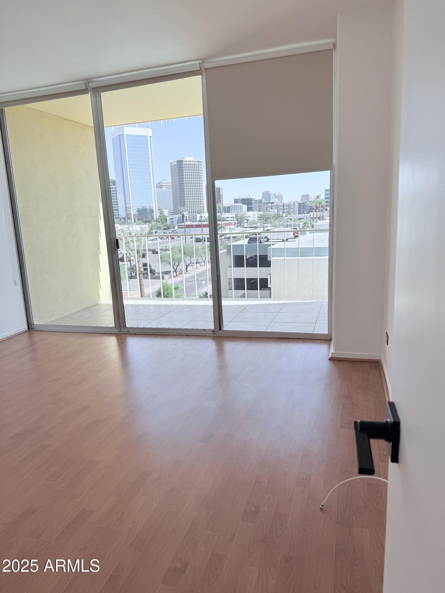 207 West Clarendon Avenue, Unit 4H Phoenix, AZ 85013 - Photo 31 of 37 a view of a big room with windows and hardwood floor