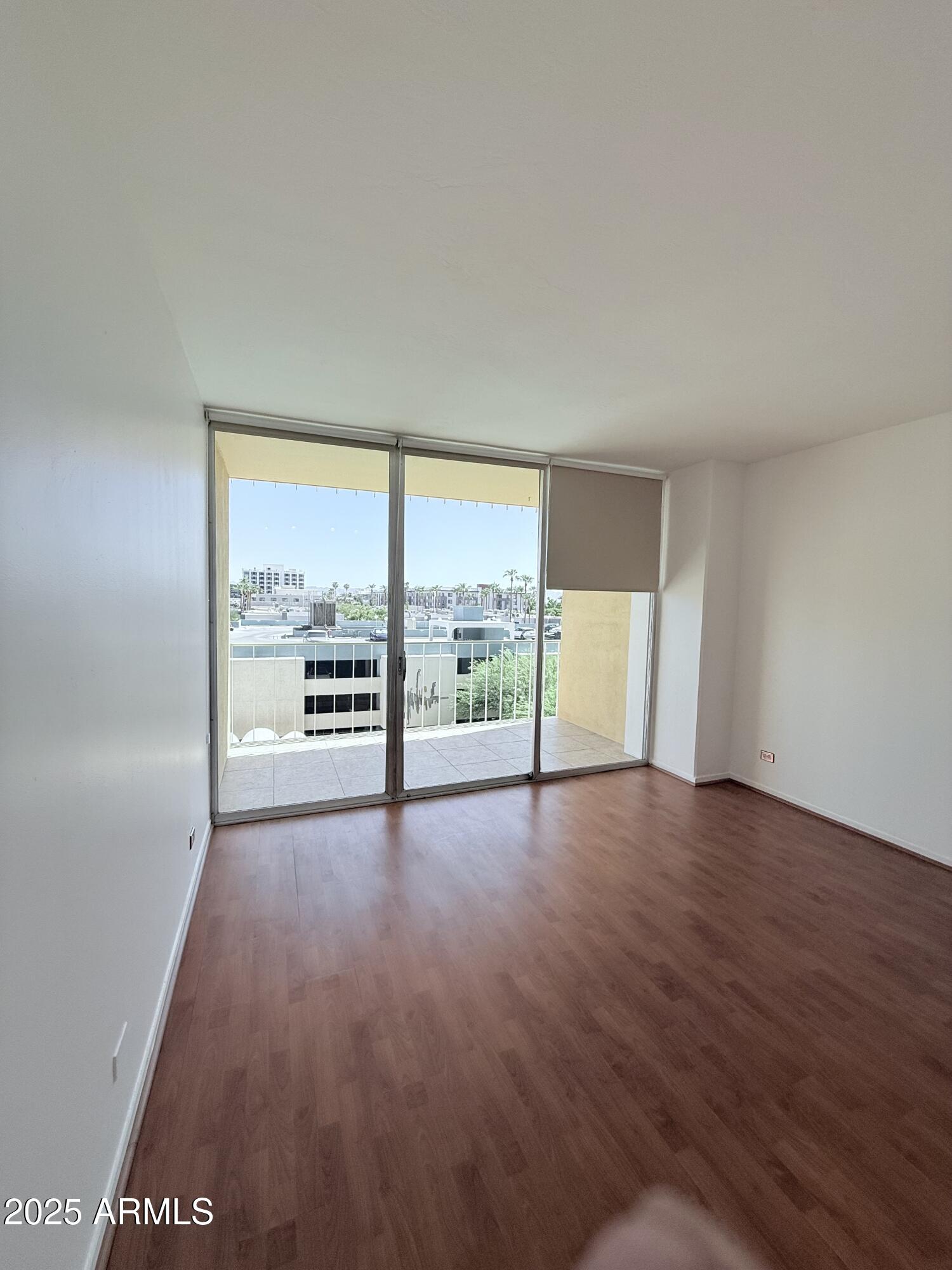 207 West Clarendon Avenue, Unit 4H Phoenix, AZ 85013 - Photo 32 of 37 a view of an empty room with a window