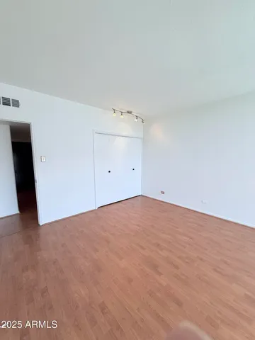 a view of an empty walk in closet