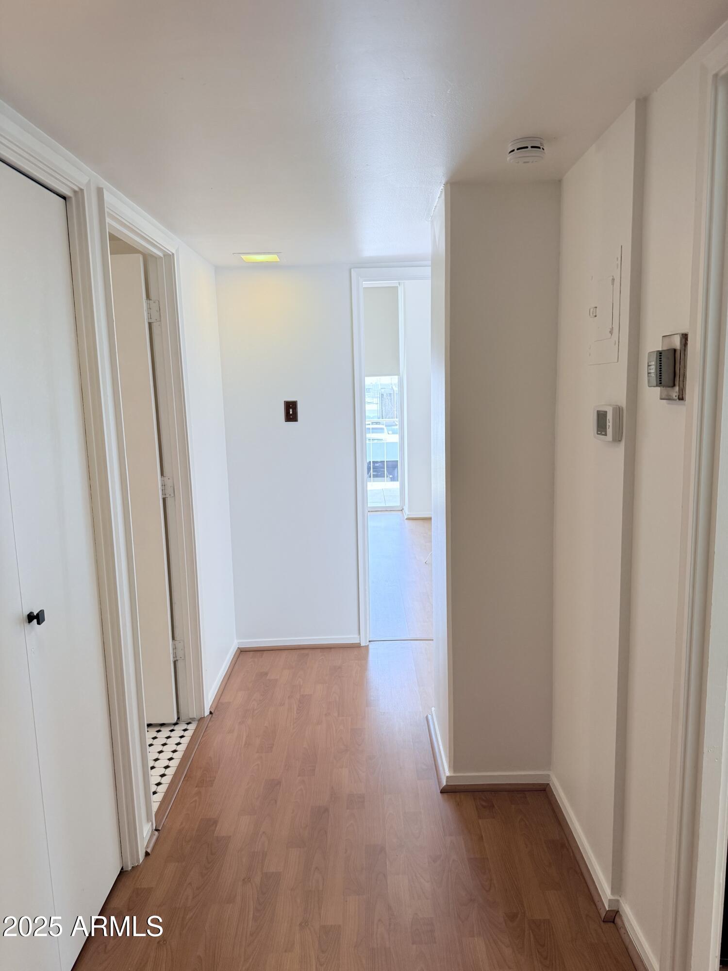 207 West Clarendon Avenue, Unit 4H Phoenix, AZ 85013 - Photo 9 of 37 a view of hallway with wooden floor