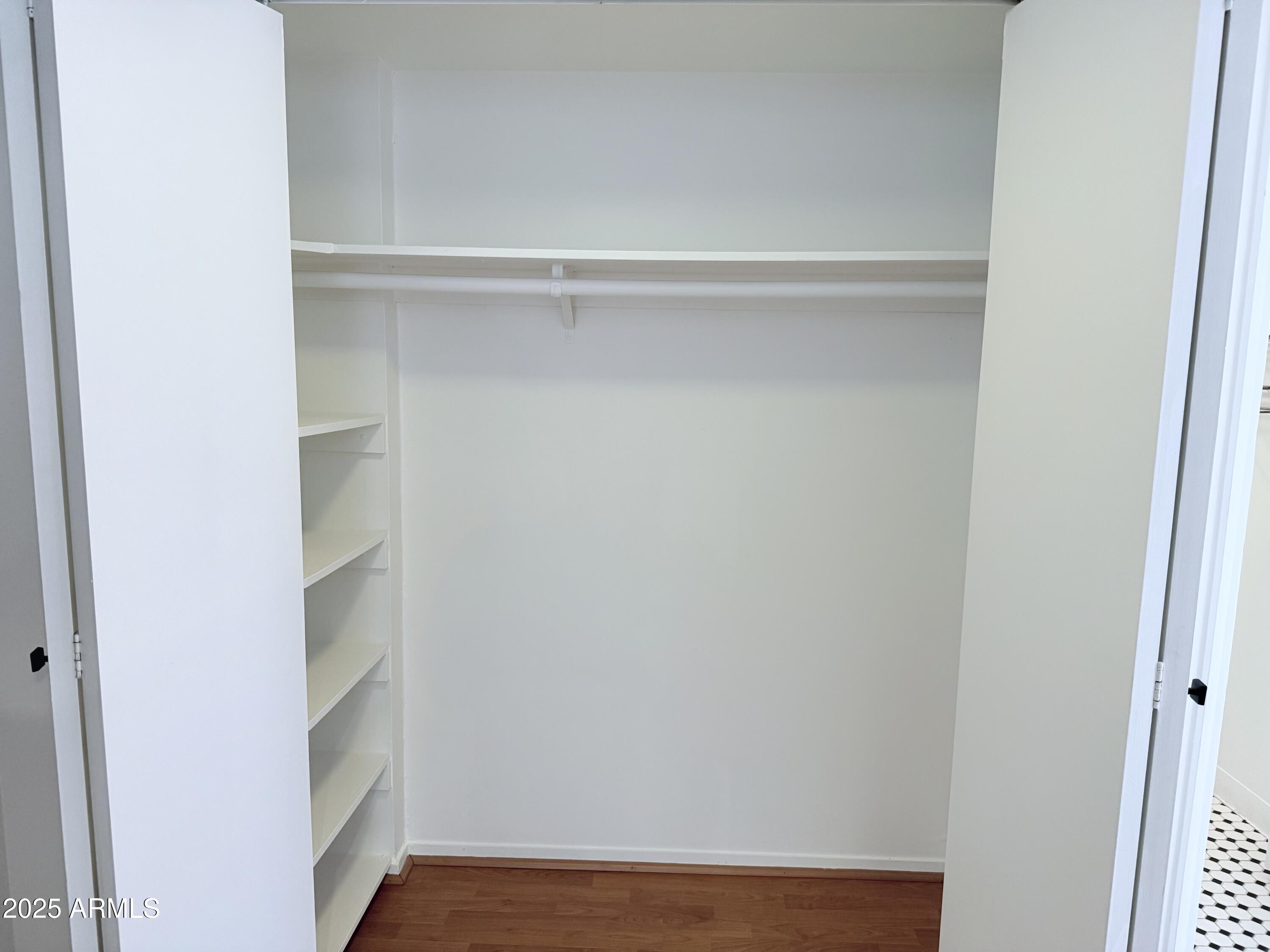 207 West Clarendon Avenue, Unit 4H Phoenix, AZ 85013 - Photo 10 of 37 a view of an empty walk in closet