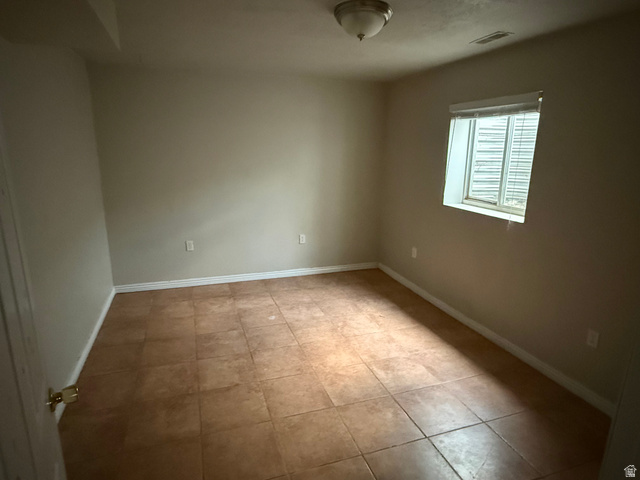874 770 South Tooele, UT 84074 - Photo 17 of 19 Neutral wall finishes complement the tile flooring