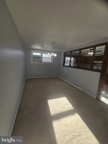 a kitchen with stainless steel appliances granite countertop a sink a stove a refrigerator with grey cabinets