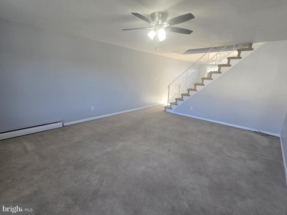 3800 Nedla Road Philadelphia, PA 19154 - Photo 9 of 31 an empty room with a chandelier fan and windows