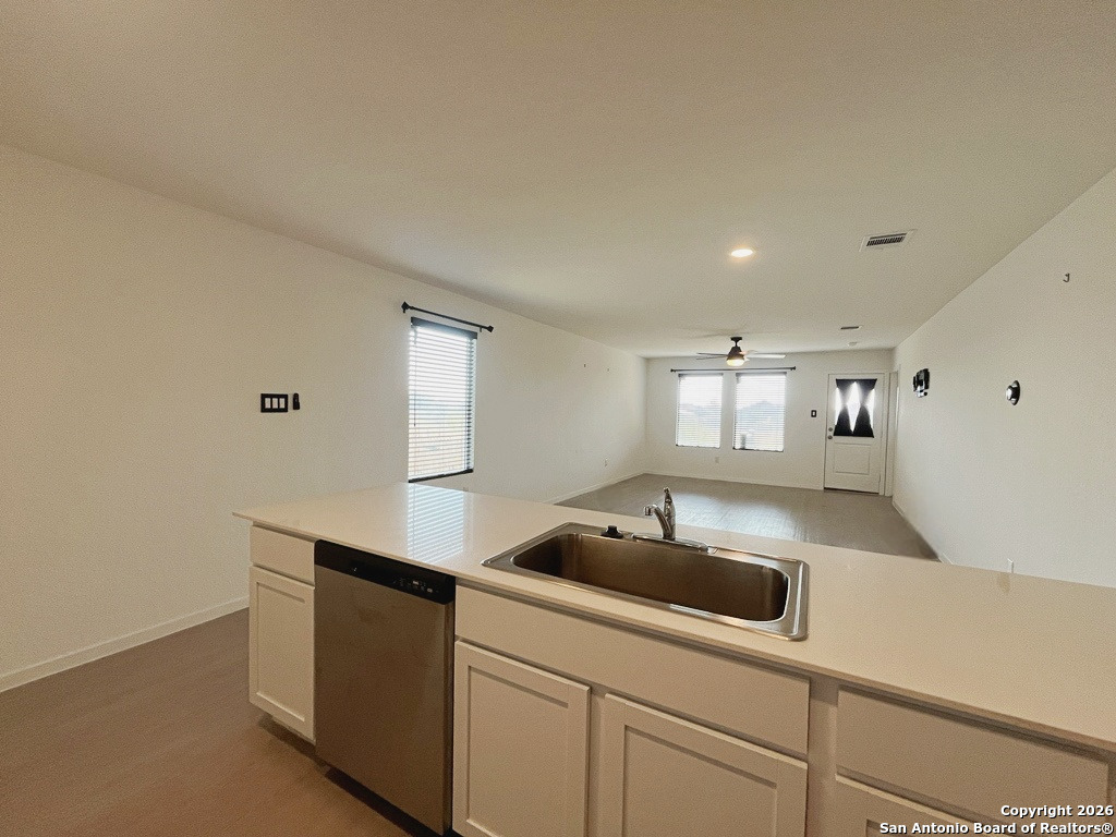 248 Cowboy Ridge Pleasanton, TX 78064 - Photo 11 of 37 a kitchen with a sink and cabinets