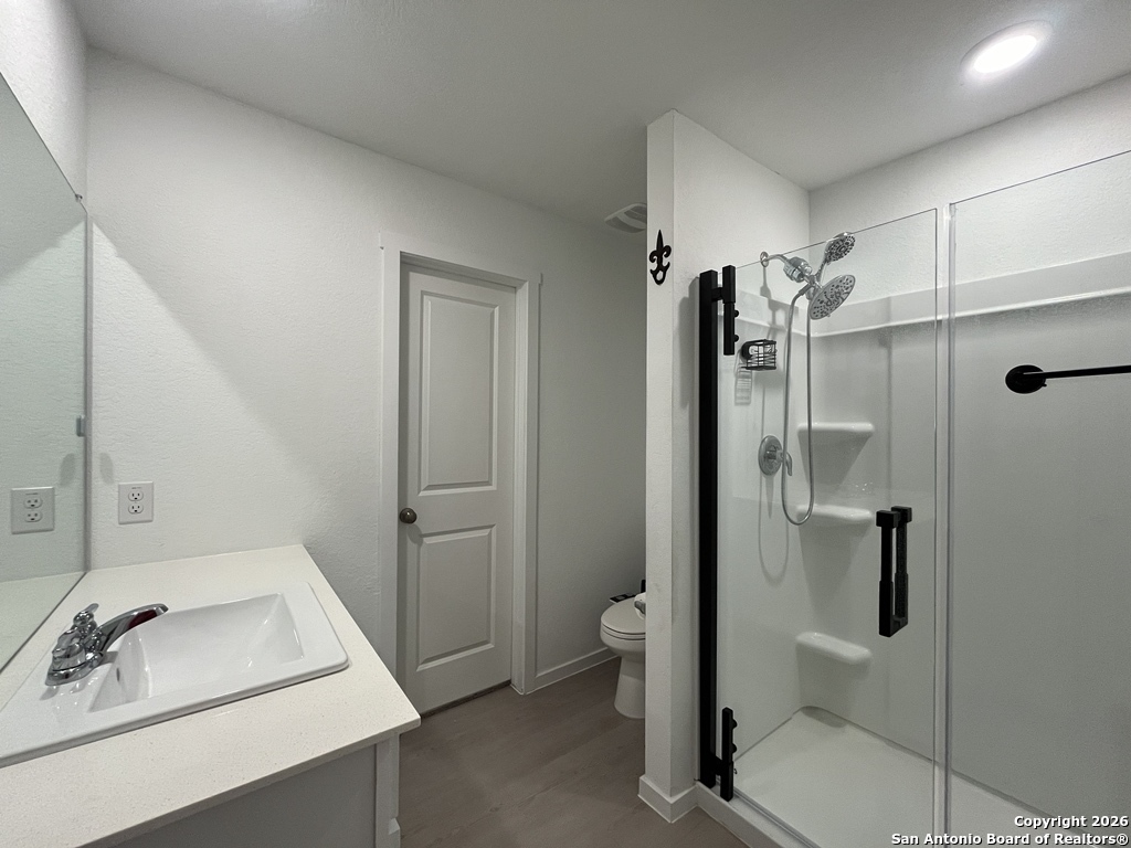 248 Cowboy Ridge Pleasanton, TX 78064 - Photo 17 of 37 a bathroom with a sink toilet and shower