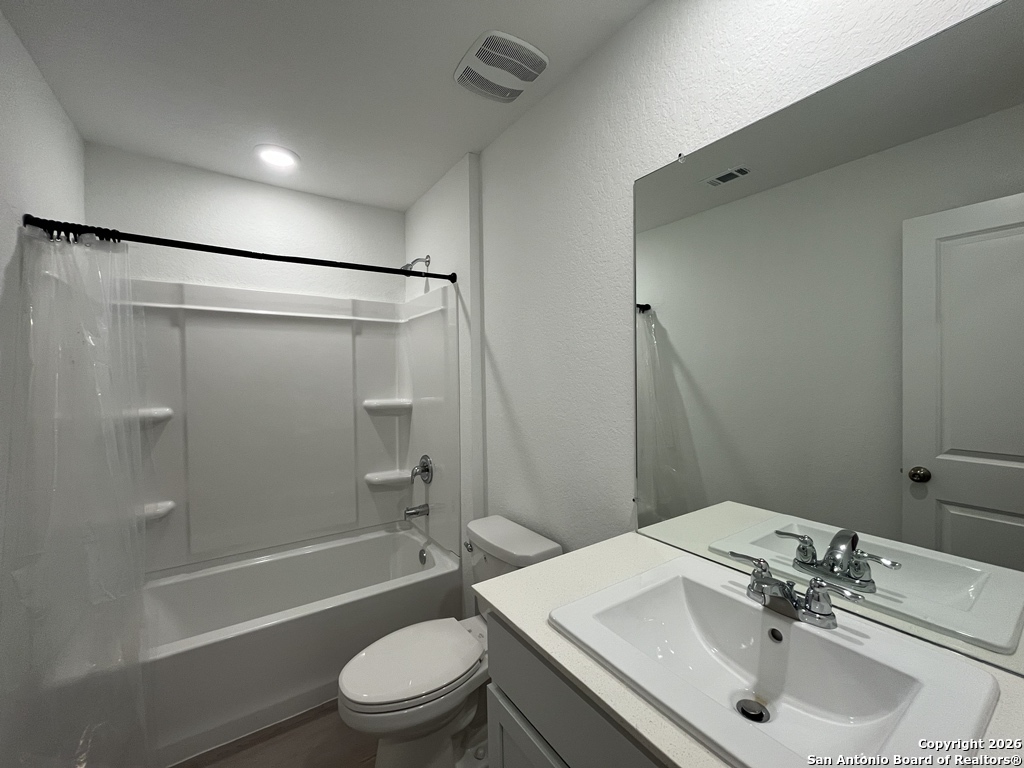 248 Cowboy Ridge Pleasanton, TX 78064 - Photo 23 of 37 a bathroom with a sink toilet and shower