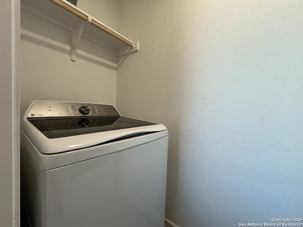 248 Cowboy Ridge Pleasanton, TX 78064 - Photo 27 of 37 a utility room with dryer and washer