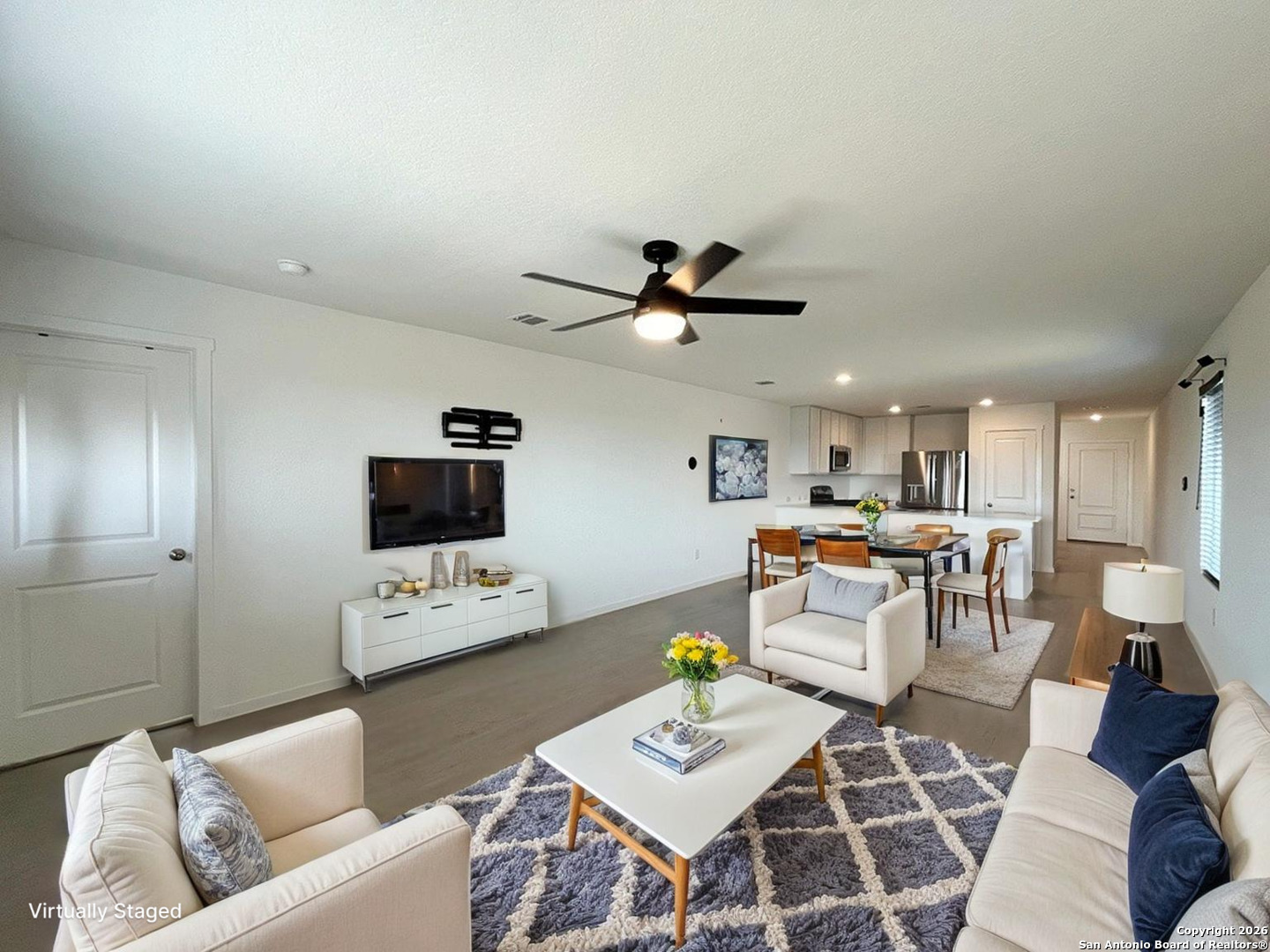 248 Cowboy Ridge Pleasanton, TX 78064 - Photo 3 of 37 a living room with furniture and a flat screen tv