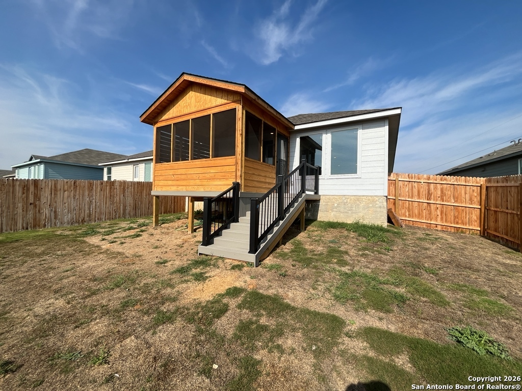 248 Cowboy Ridge Pleasanton, TX 78064 - Photo 32 of 37 a front view of a house with a yard