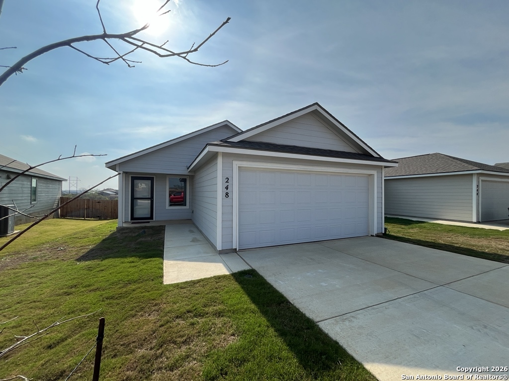 248 Cowboy Ridge Pleasanton, TX 78064 - Photo 34 of 37 a front view of house with yard