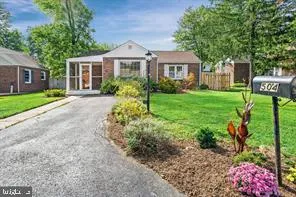 a front view of a house with a yard and an outdoor seating