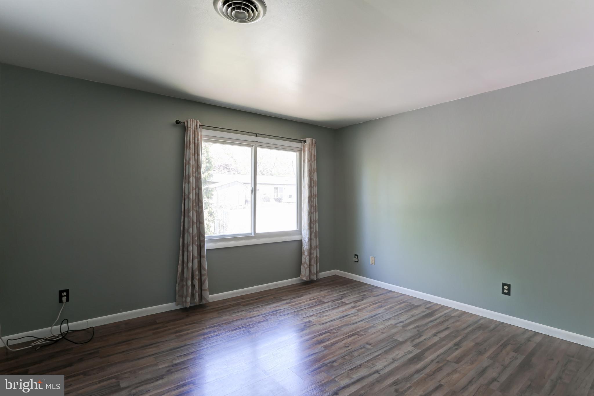 447 West Ridge Road Elizabethtown, PA 17022 - Photo 14 of 28 an empty room with wooden floor and windows