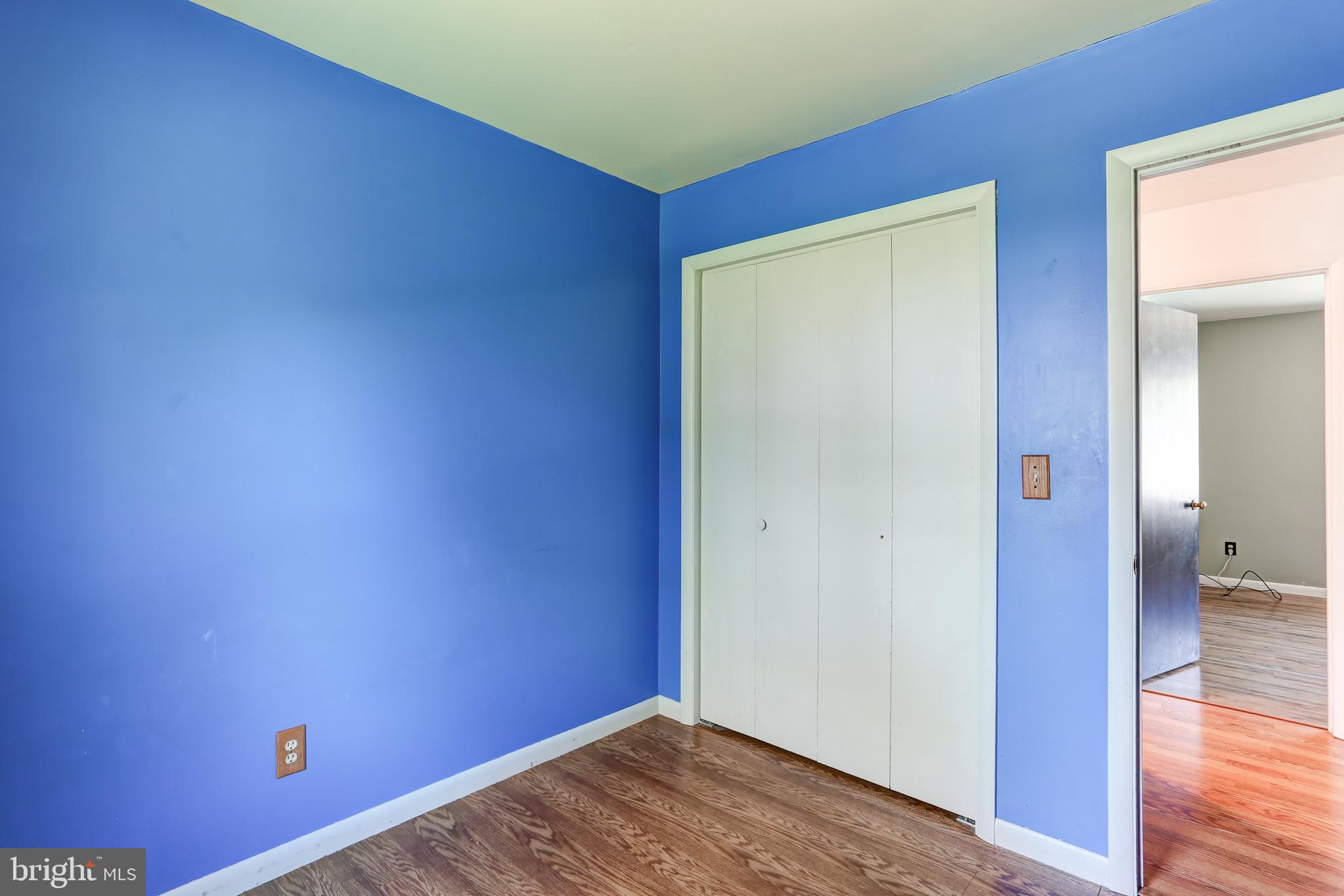 447 West Ridge Road Elizabethtown, PA 17022 - Photo 18 of 28 an empty room with wooden floor and a bathroom