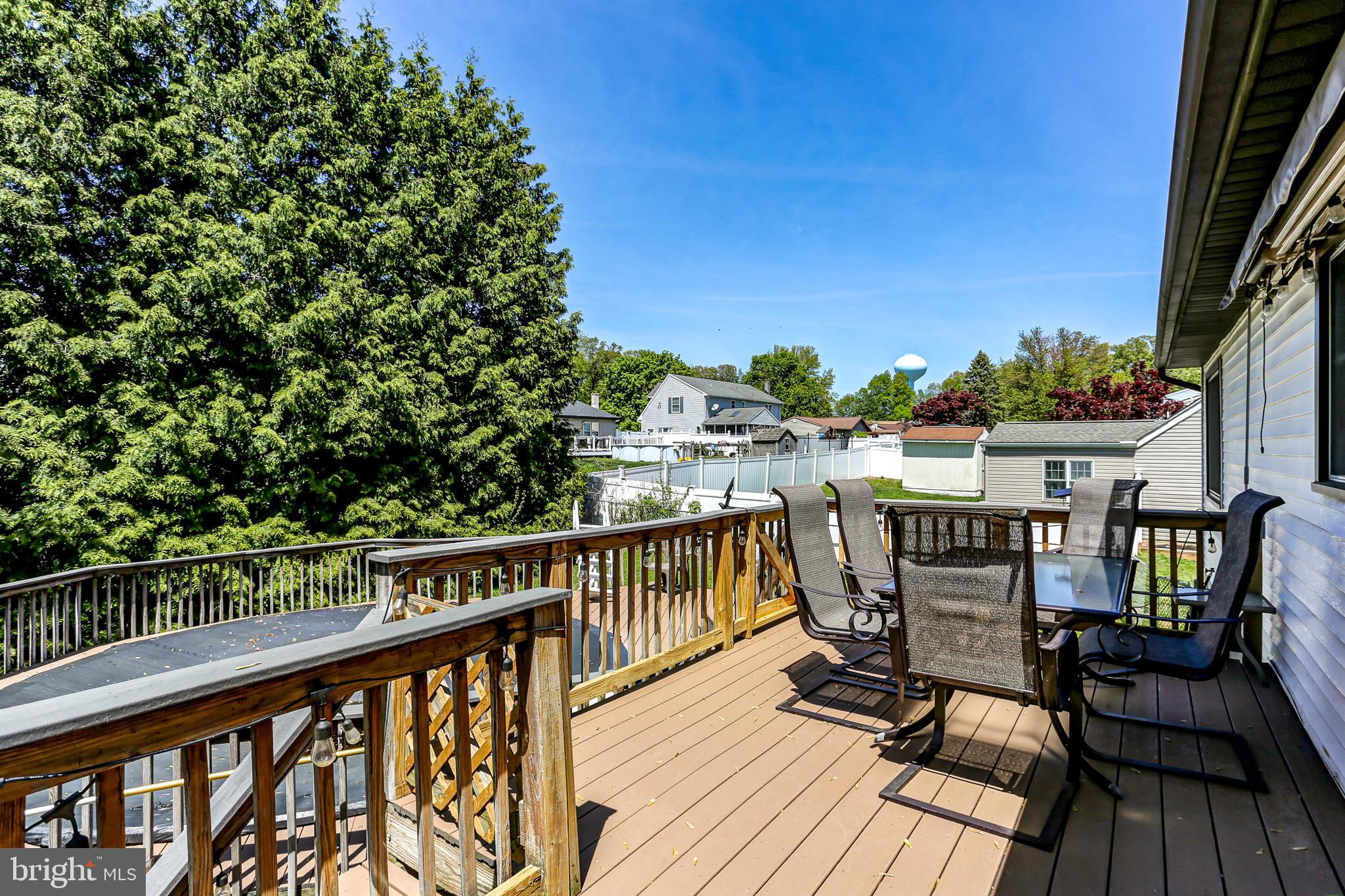 447 West Ridge Road Elizabethtown, PA 17022 - Photo 25 of 28 a view of a balcony with wooden chairs and floor to ceiling window